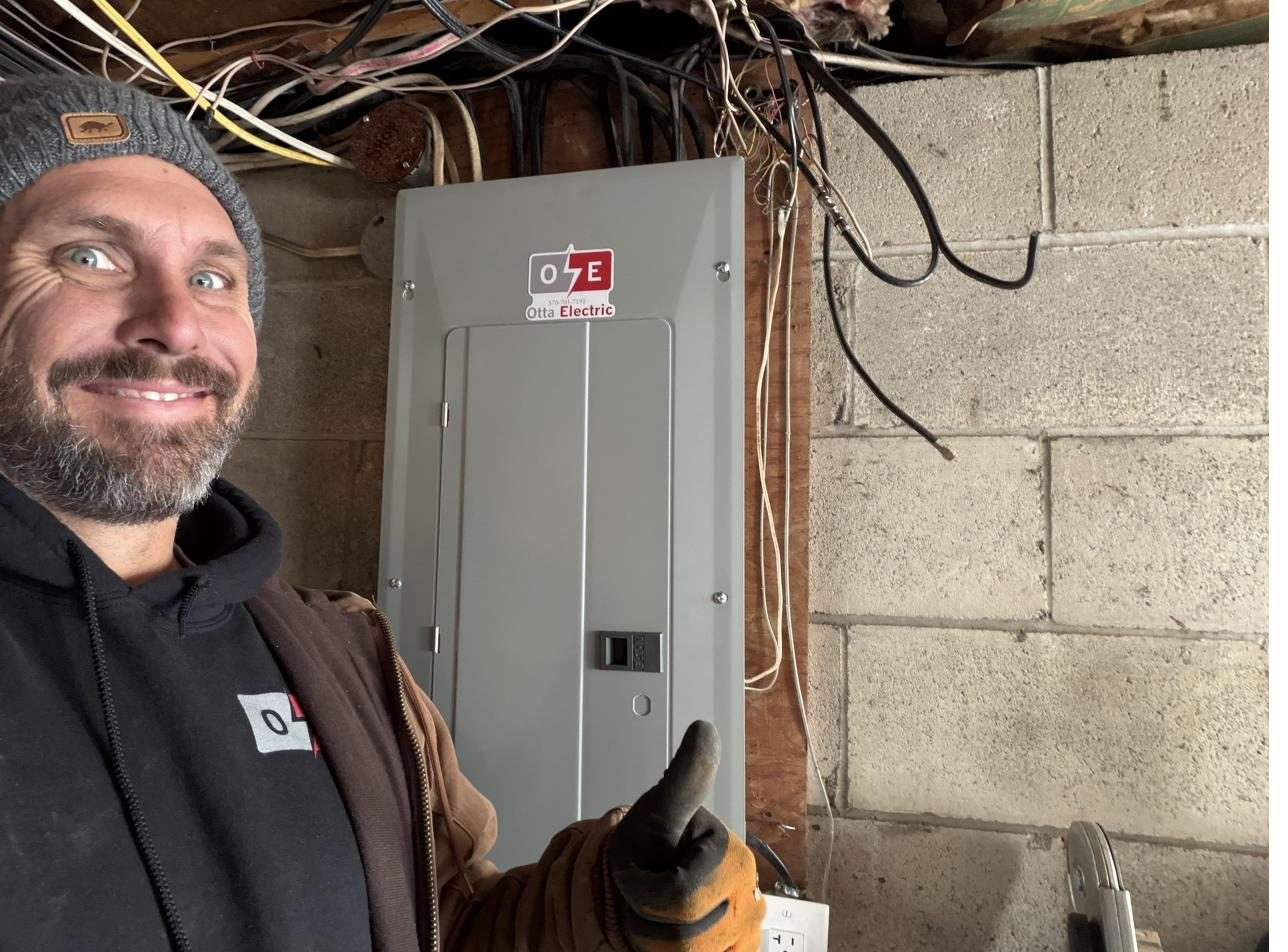 Andrew Otta at a completed panel upgrade job